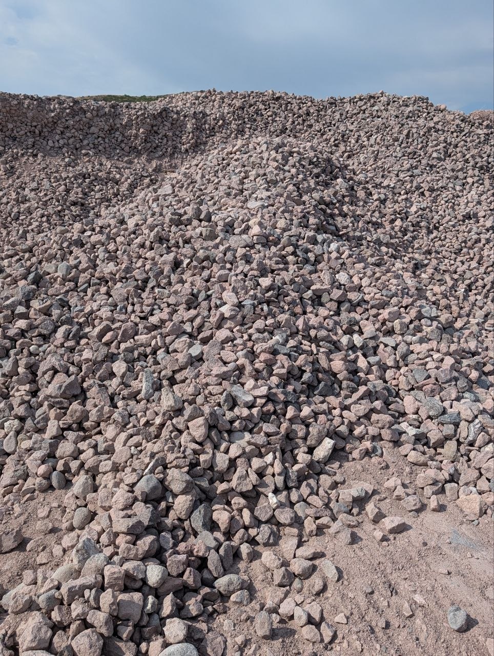 Stockpile of angular 4-inch riprap rock.